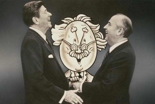 Reagan and Gorbachev shaking heads because of the Egghead