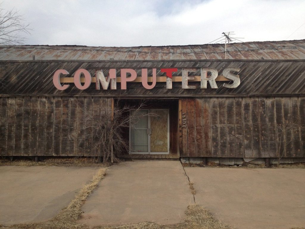 image of a decaying building that just says "Computers"