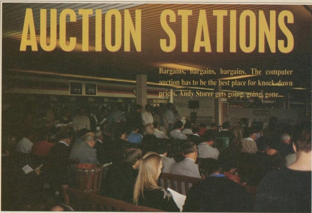 people sitting at an auction with the headline "Auction Stations"