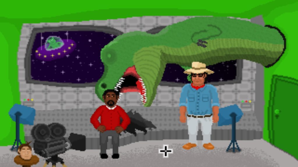 a picture of two men in front of a fake dinosaur and a head on a stool behind a camera