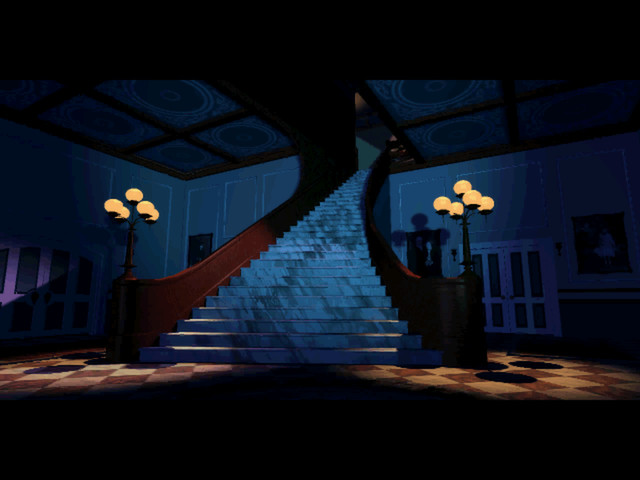 inside of a dark mansion with stairs going up to a second floor