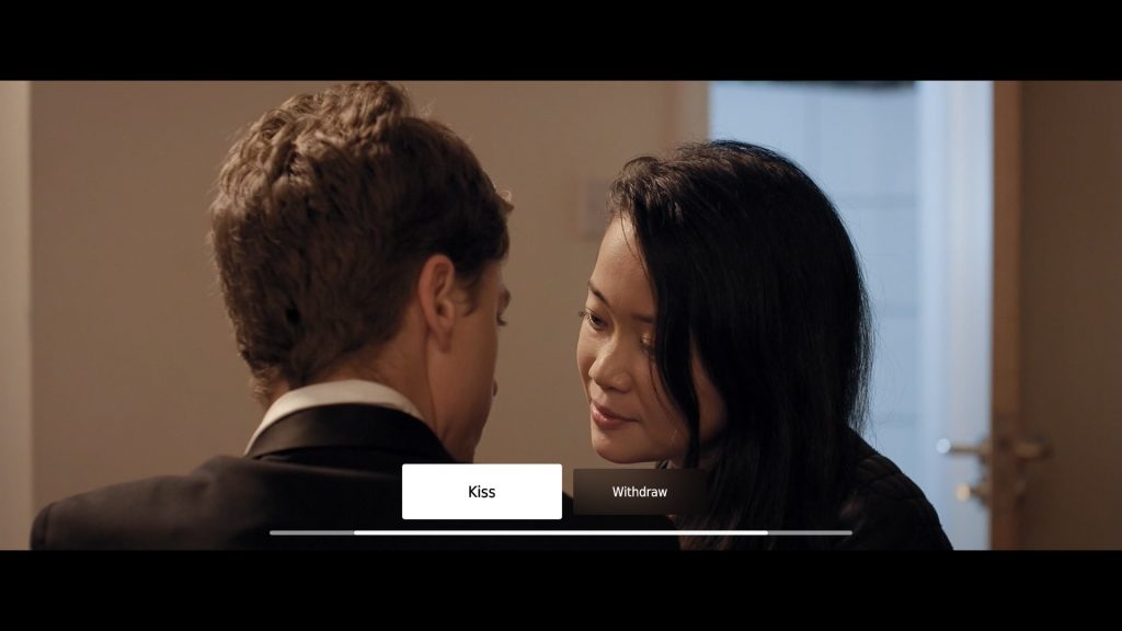 a man and woman leaning in to kiss, with the choices being Kiss and Withdraw