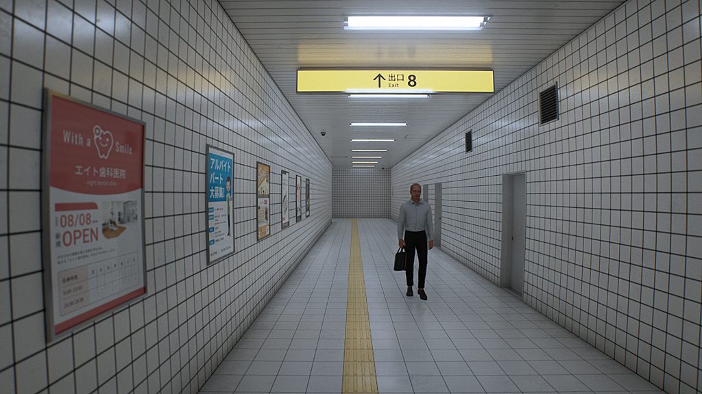 a business man standing in a long hallway