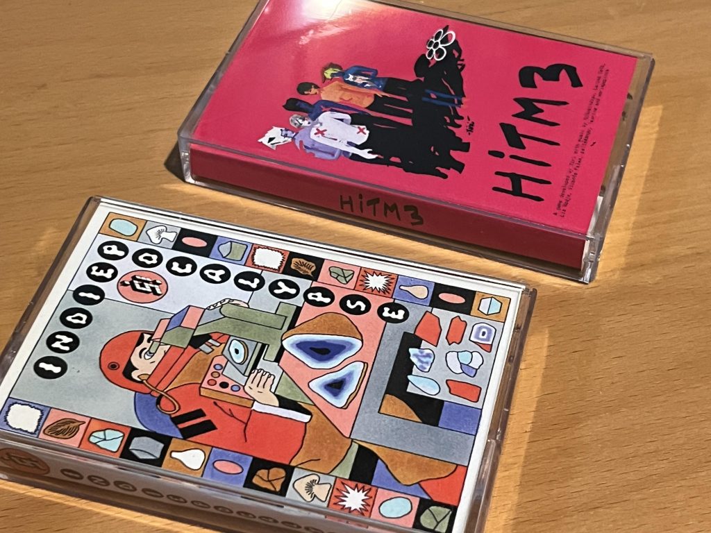 Photo of an Indiepocalypse collection and HITM3 in cassette tape cases