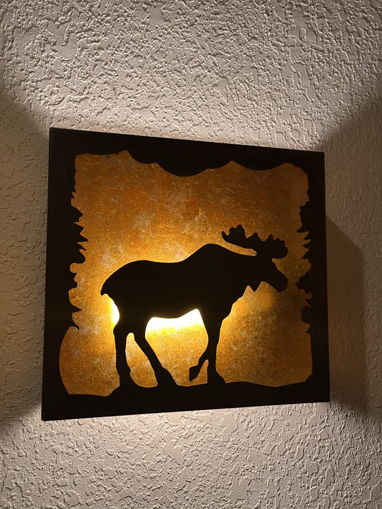 a light with a moose decoration