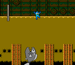 mega man jumping in gross brown yellow water over a fish