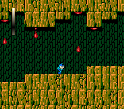 Mega Man running through a cave while red drops fall from the ceiling