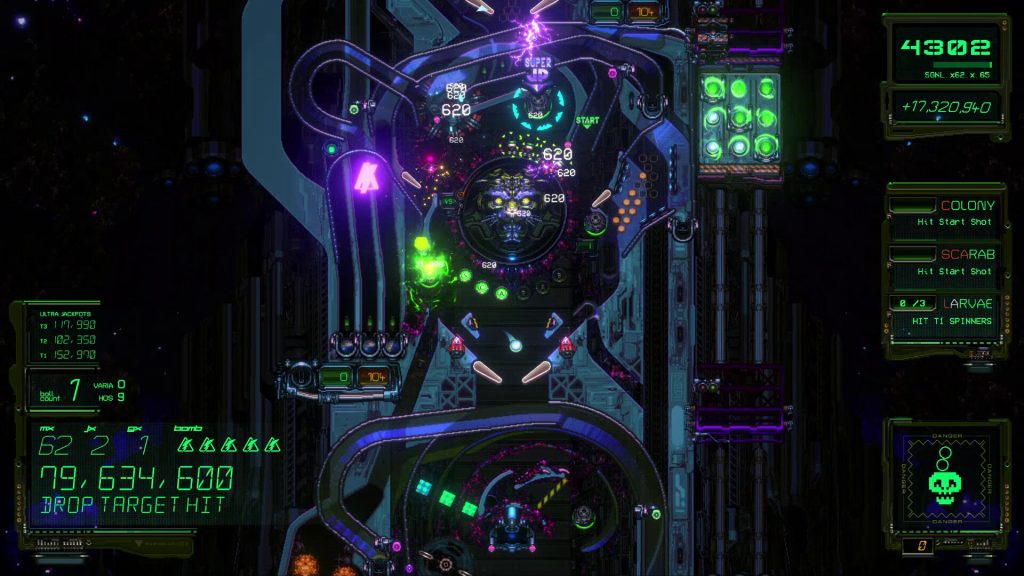 big sci-fi looking pinball table with a robot face in the center
